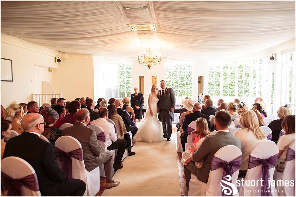 Beautiful photographs of the wedding ceremony at Warwick House in Southam by Documentary Wedding Photographer Stuart James