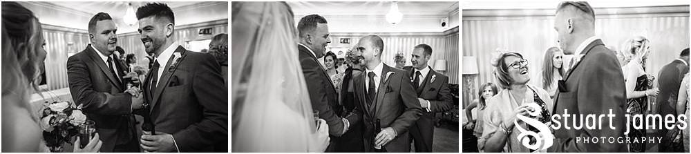 Beautiful moments as the guests greet the newly married couple at Warwick House in Southam by Documentary Wedding Photographer Stuart James
