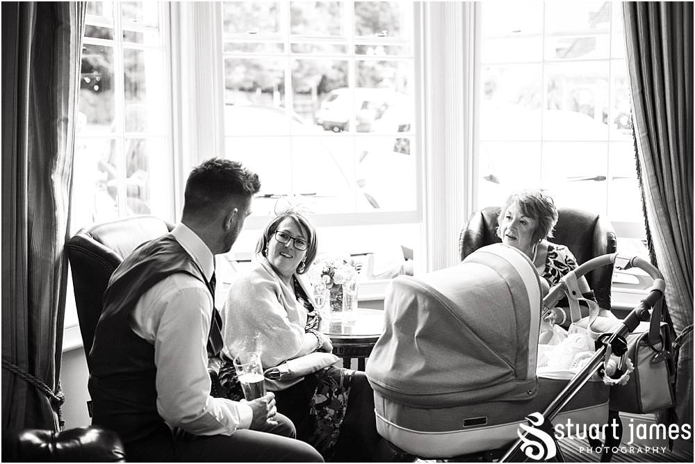 Candid photographs of the guests enjoying the evening reception at the beautiful Warwick House in Southam by Documentary Wedding Photographer Stuart James