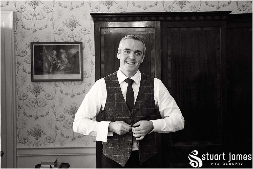 Documenting the grooms dressing at Weston Park in Staffordshire by Documentary Wedding Photographer Stuart James