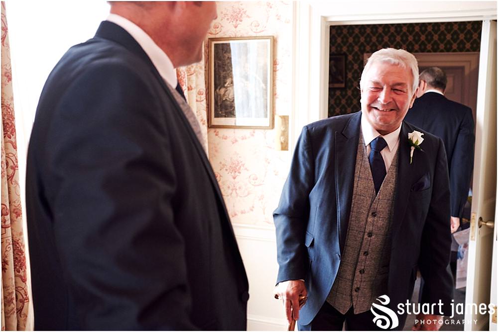 Documenting the grooms dressing at Weston Park in Staffordshire by Documentary Wedding Photographer Stuart James