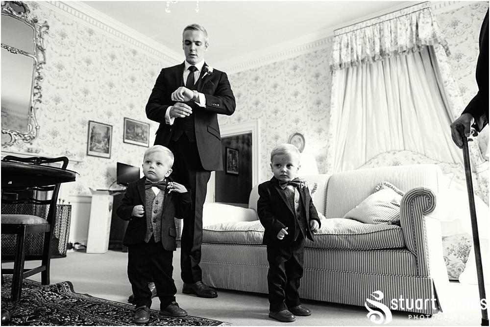 Capturing the preparations as the pageboys are dressed at Weston Park in Staffordshire by Documentary Wedding Photographer Stuart James