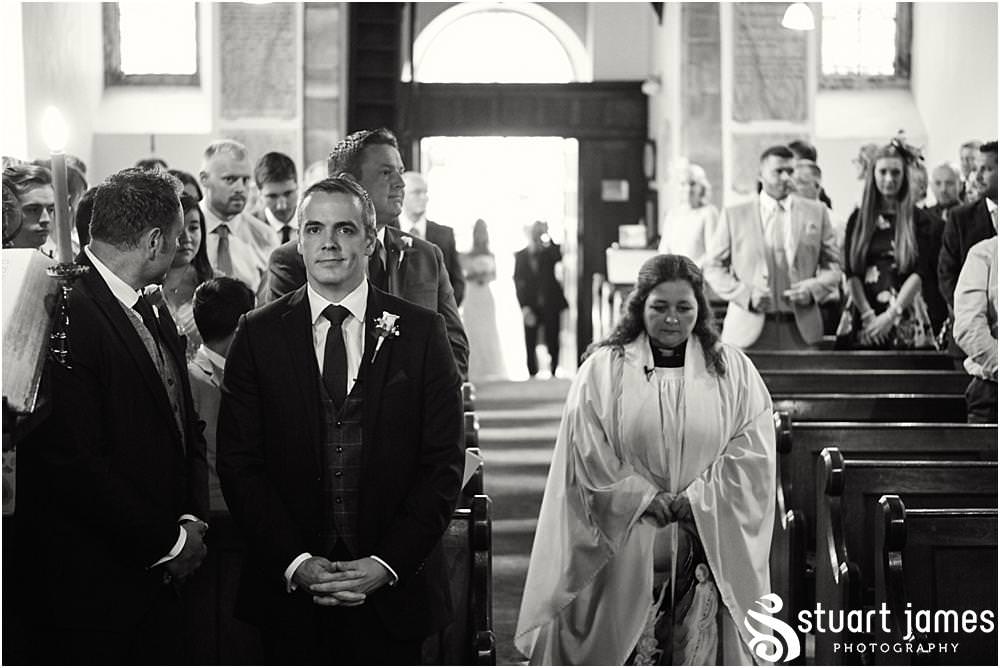 Documenting the entrance of the bride to the ceremony at St Andrews Church in Weston Park, Staffordshire by Documentary Wedding Photographer Stuart James