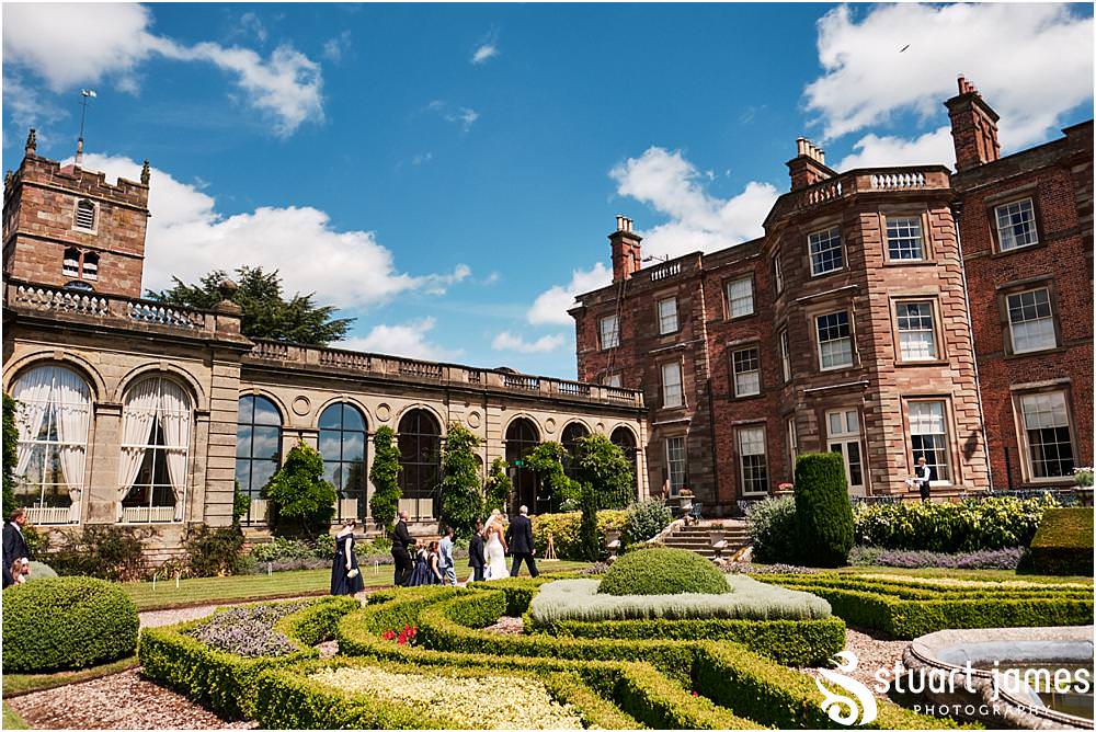 Relaxed creative photographs as the bride and groom lead the guests to the reception at Weston Park in Staffordshire by Documentary Wedding Photographer Stuart James