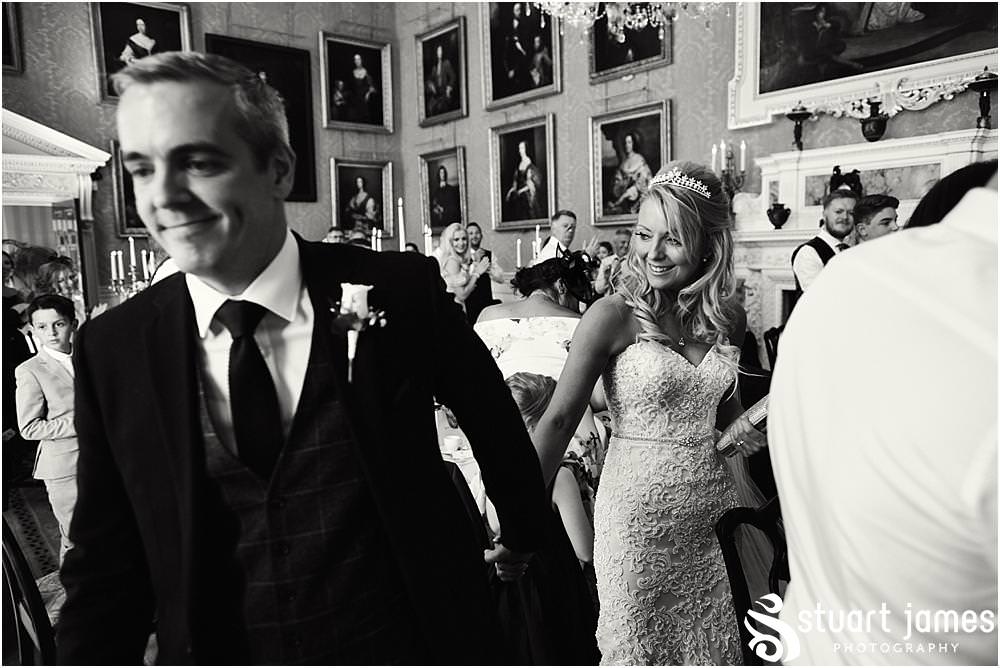 Capturing the entrance of the bride and groom to the wedding breakfast at Weston Park in Staffordshire by Documentary Wedding Photographer Stuart James