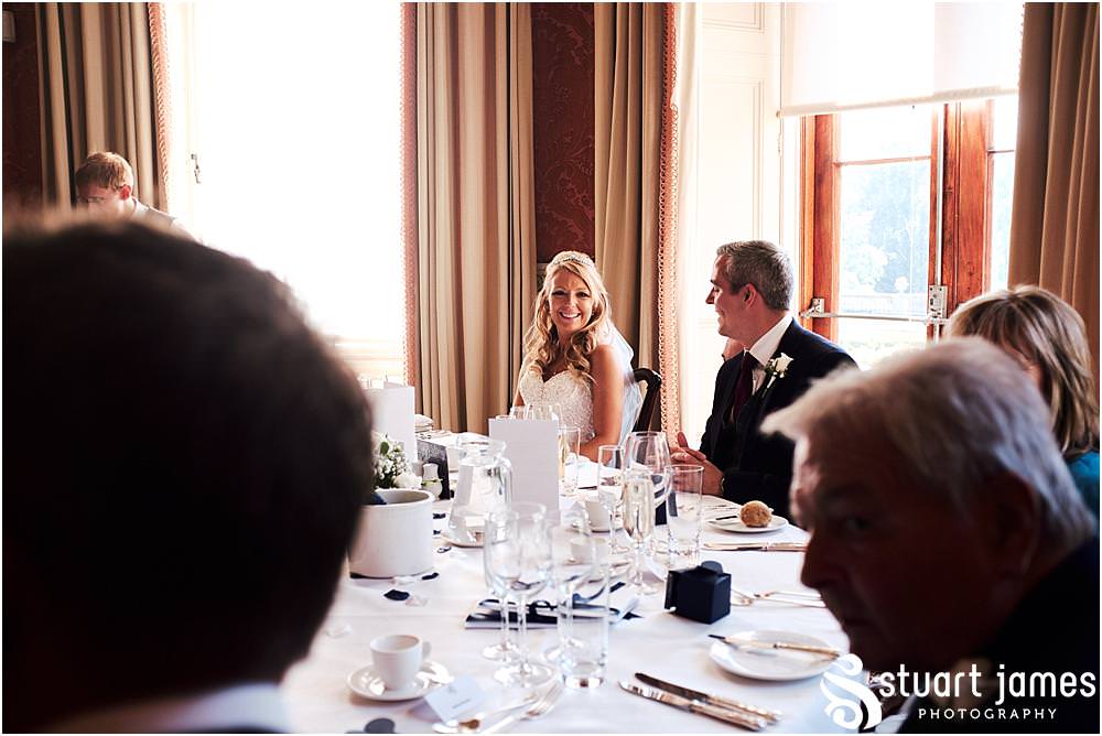 Capturing the entrance of the bride and groom to the wedding breakfast at Weston Park in Staffordshire by Documentary Wedding Photographer Stuart James