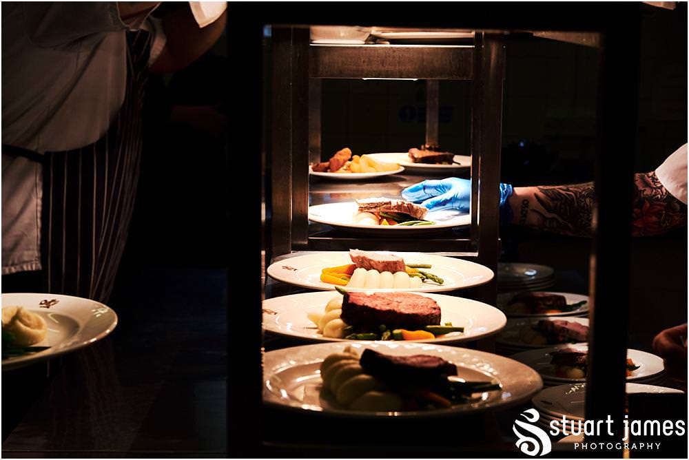 Creative photographs of dinner service in the kitchens at Weston Park in Staffordshire by Documentary Wedding Photographer Stuart James