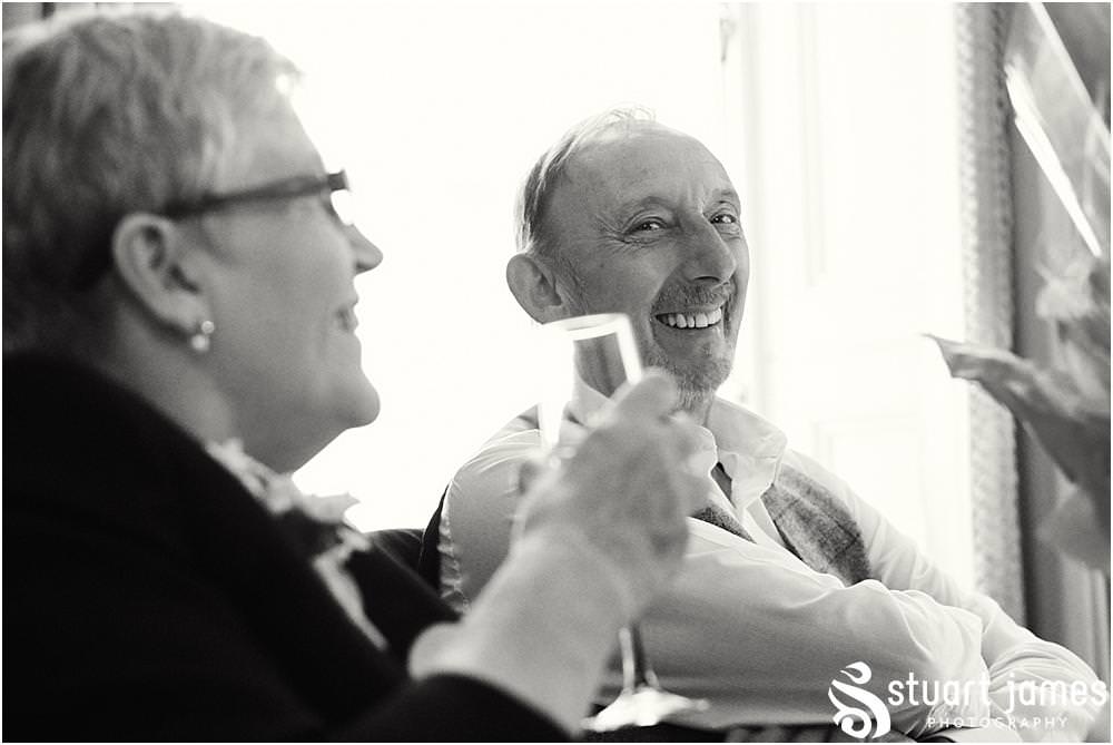 Creative photographs capturing the mood and reaction to the grooms speech at Weston Park in Staffordshire by Documentary Wedding Photographer Stuart James