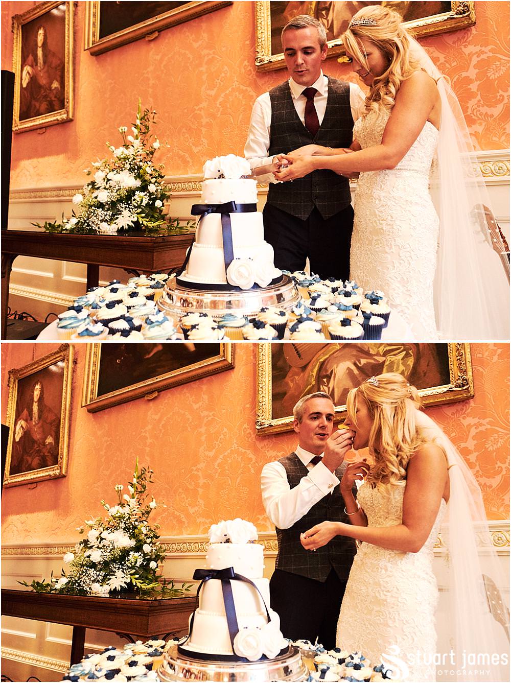 Cake cutting fun at Weston Park in Staffordshire by Documentary Wedding Photographer Stuart James
