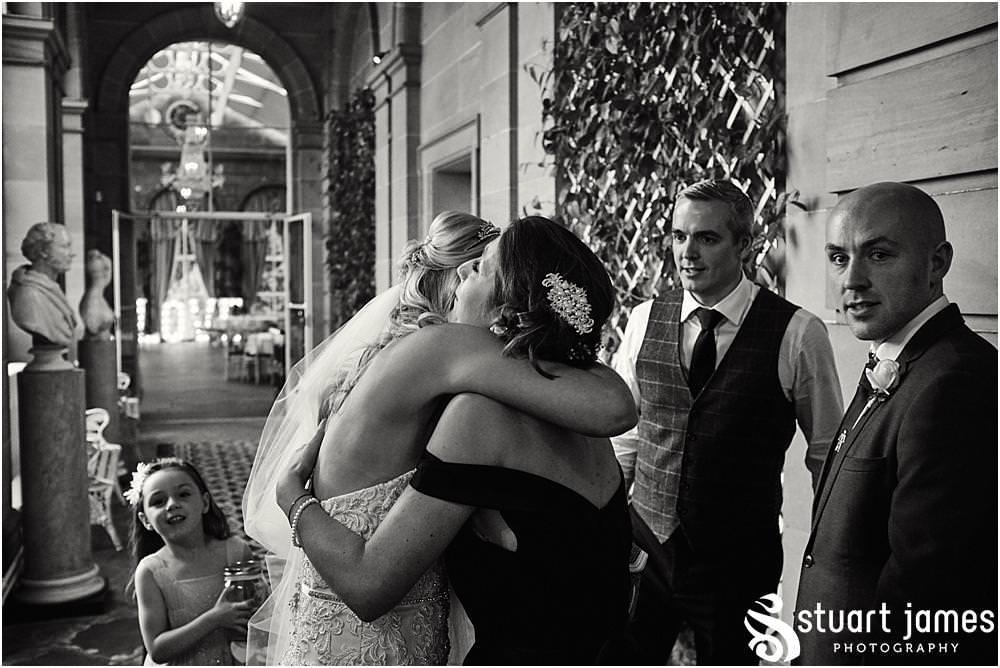 Candid photographs of the guests enjoying the evening reception at the fabulous setting of Weston Park in Staffordshire by Documentary Wedding Photographer Stuart James