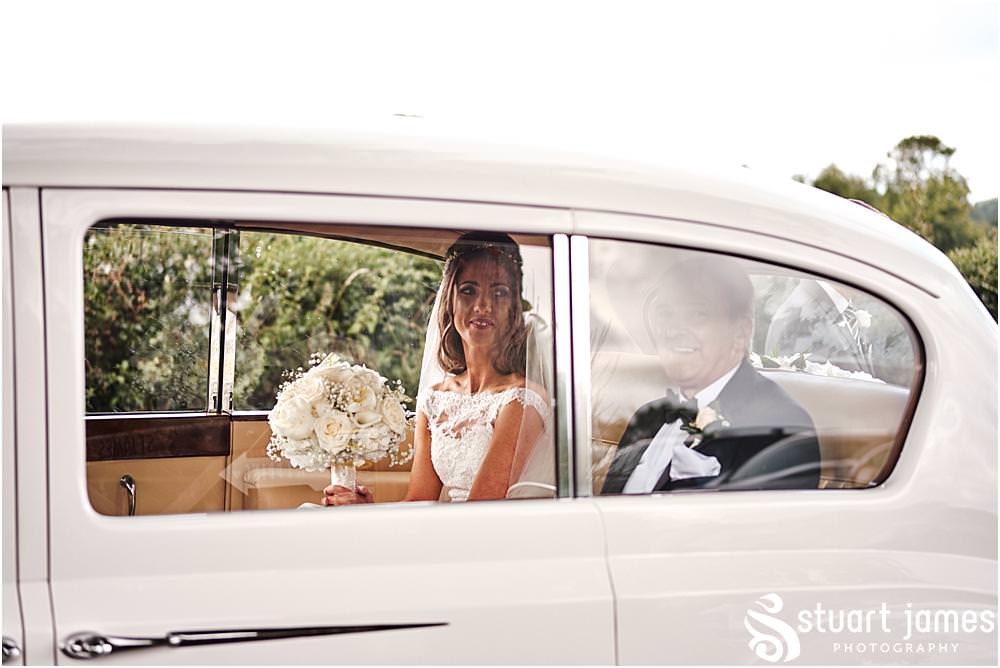 The arrival of the beautiful bride with her father at St James Church in Acton Trussell by Documentary Wedding Photographer Stuart James