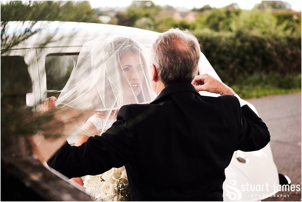 The arrival of the beautiful bride with her father at St James Church in Acton Trussell by Documentary Wedding Photographer Stuart James