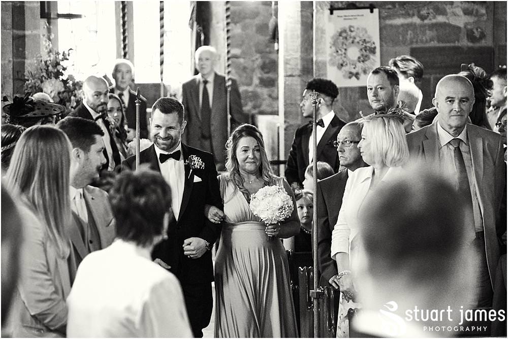 Capturing the beautiful bridal procession down the aisle at St James Church in Acton Trussell by Documentary Wedding Photographer Stuart James