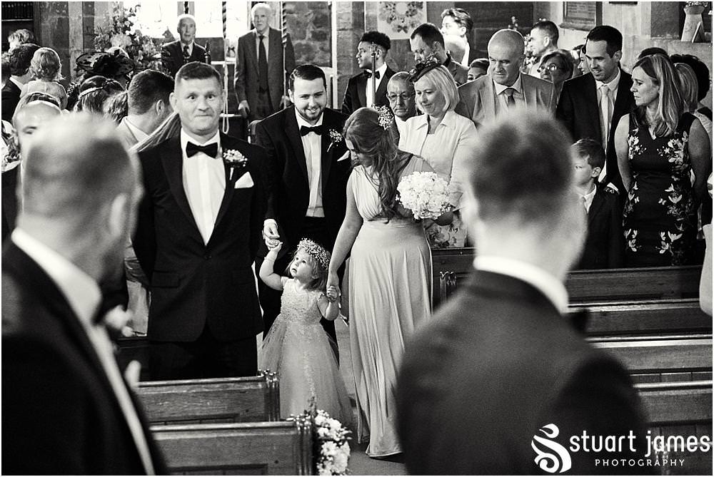 Capturing the beautiful bridal procession down the aisle at St James Church in Acton Trussell by Documentary Wedding Photographer Stuart James