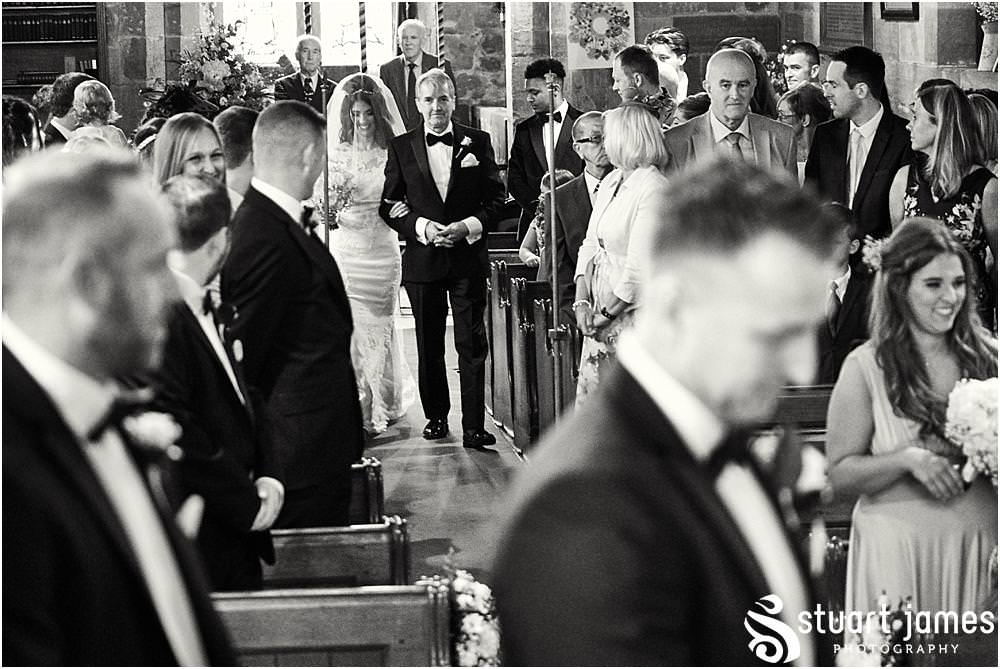 Capturing the beautiful bridal procession down the aisle at St James Church in Acton Trussell by Documentary Wedding Photographer Stuart James