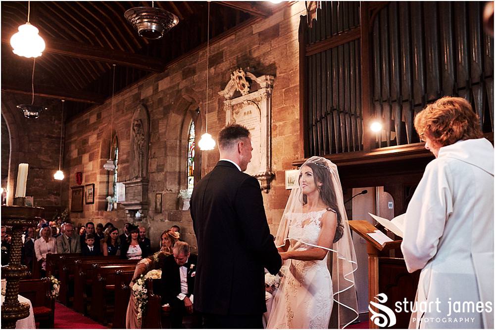 Unobtrusive silent photographs capturing each and every moment of the beautiful wedding ceremony at St James Church in Acton Trussell by Documentary Wedding Photographer Stuart James