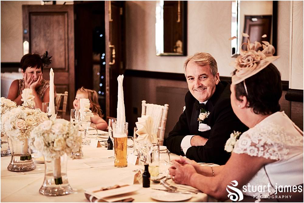 Creative candid photographs of the guests enjoying the afternoon reception at The Moat House in Acton Trussell by Documentary Wedding Photographer Stuart James