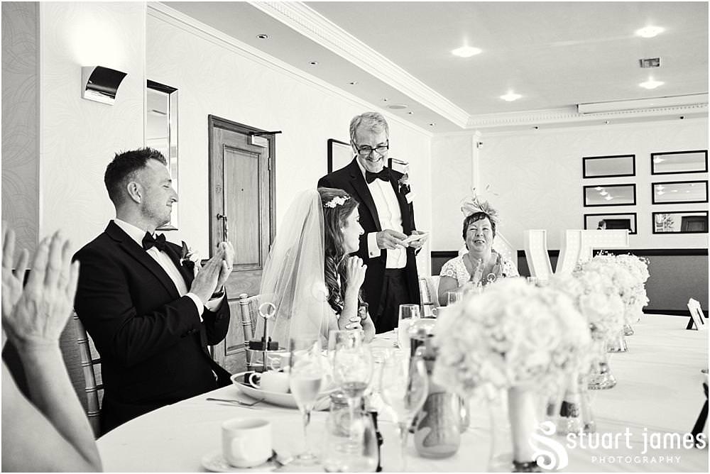 Documentary photographs capturing the wonderful speech and guest reactions at The Moat House in Acton Trussell by Documentary Wedding Photographer Stuart James