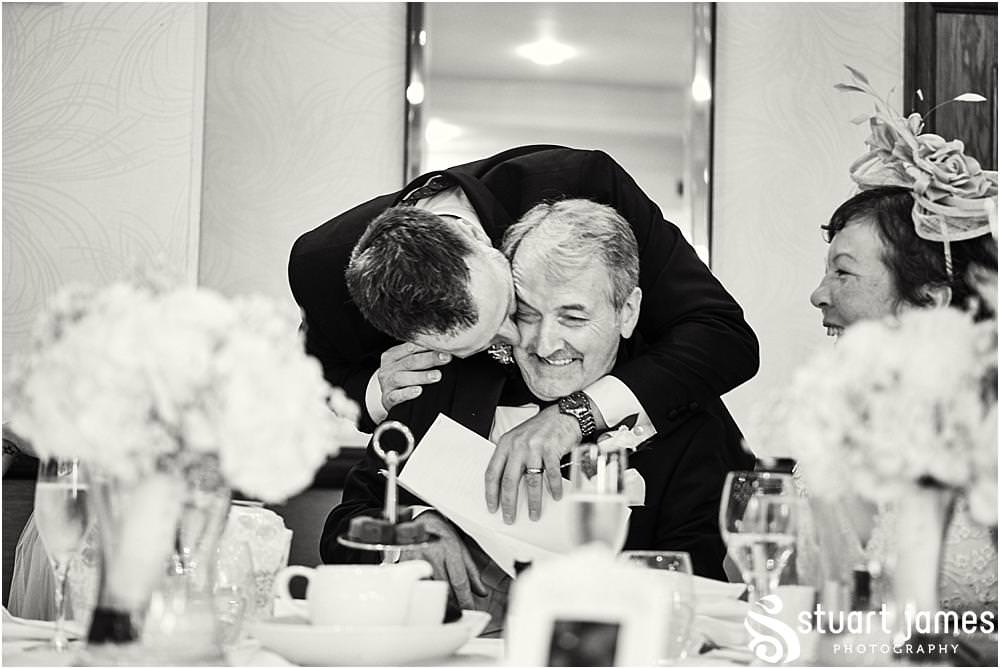 Creative documentary photography of the Grooms speech and the emotional and humorous reactions of the guests at The Moat House in Acton Trussell by Documentary Wedding Photographer Stuart James
