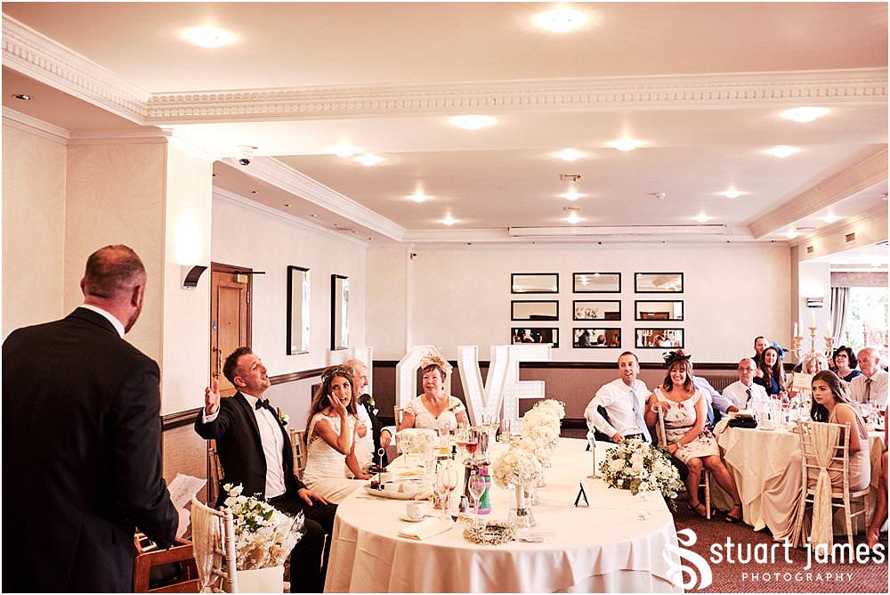 Capturing the fun and reaction to the speeches from the best men at The Moat House in Acton Trussell by Documentary Wedding Photographer Stuart James