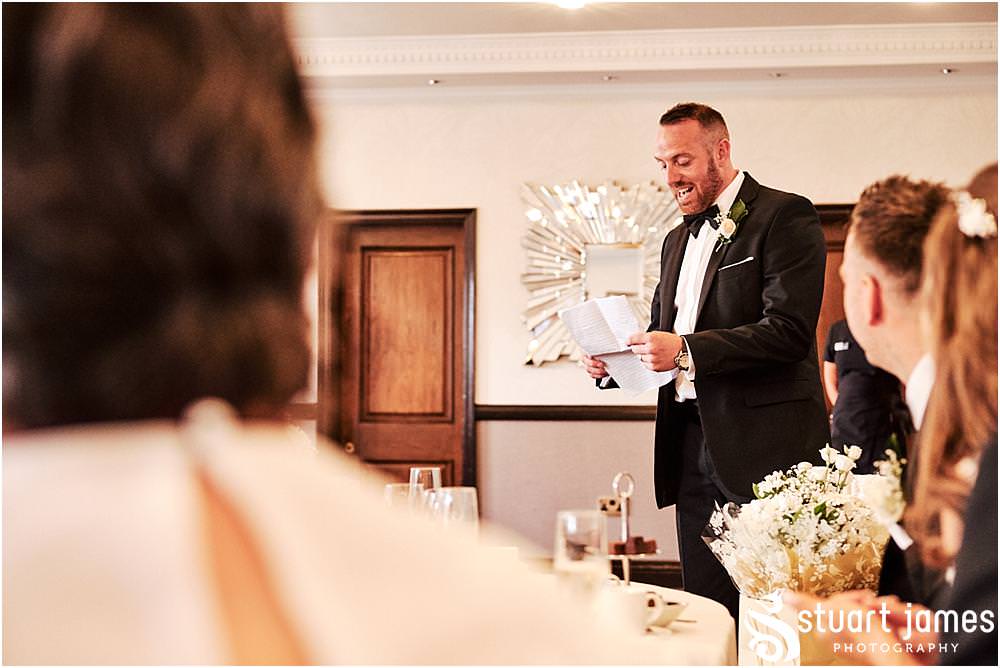 Capturing the fun and reaction to the speeches from the best men at The Moat House in Acton Trussell by Documentary Wedding Photographer Stuart James
