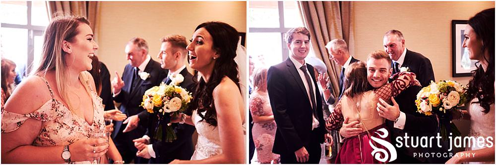 Capturing the entrance of the guests and the bride and groom to the wedding breakfast at The Belfry in Sutton Coldfield by West Midlands Wedding Photographer Stuart James