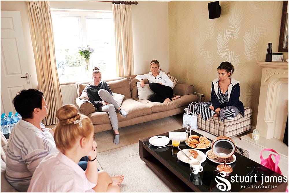 Candid photographs of the bridal party ahead of the wedding at home in Bloxwich by Documentary Wedding Photographer Stuart James