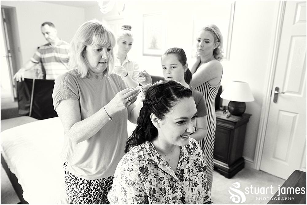 Finishing touches to the bridal hair at home in Bloxwich by Documentary Wedding Photographer Stuart James