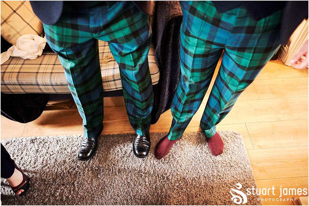 Documenting the preparations of the groom in his jacket and tartan trews at home in Bloxwich by Documentary Wedding Photographer Stuart James