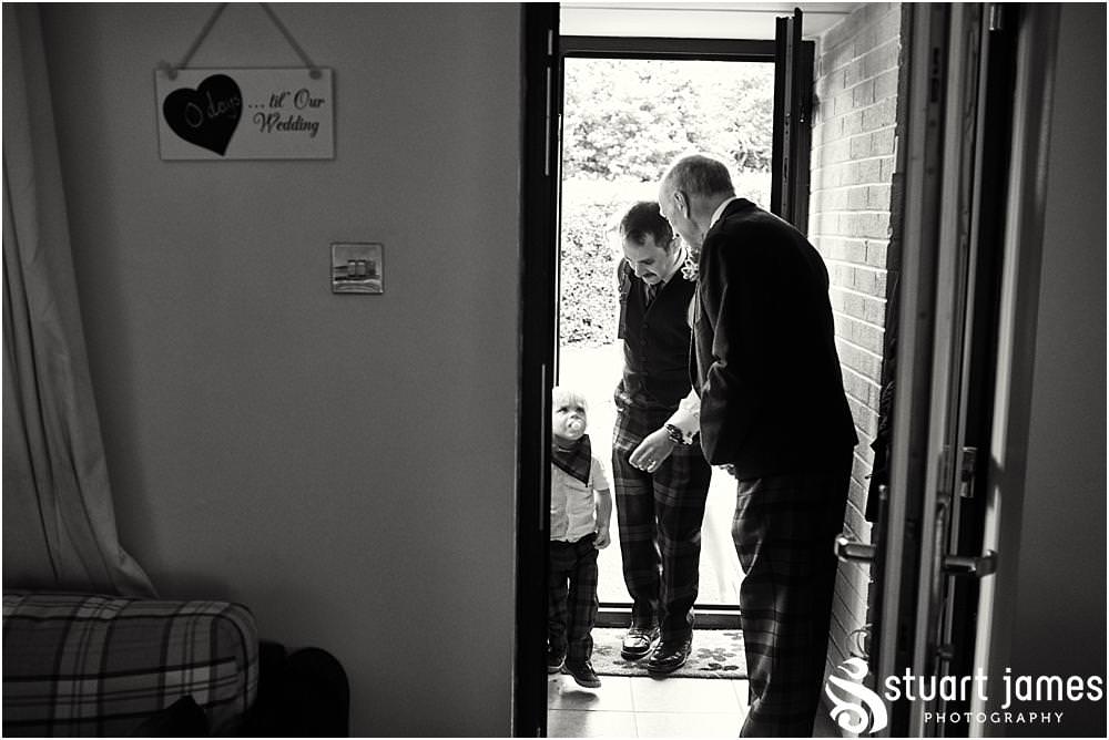 Capturing the mood and characters ahead of the wedding with the grooms party at home in Bloxwich by Documentary Wedding Photographer Stuart James