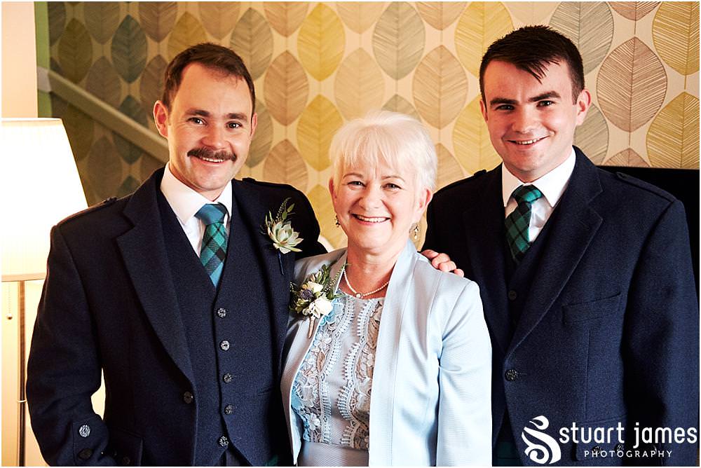 Capturing the mood and characters ahead of the wedding with the grooms party at home in Bloxwich by Documentary Wedding Photographer Stuart James