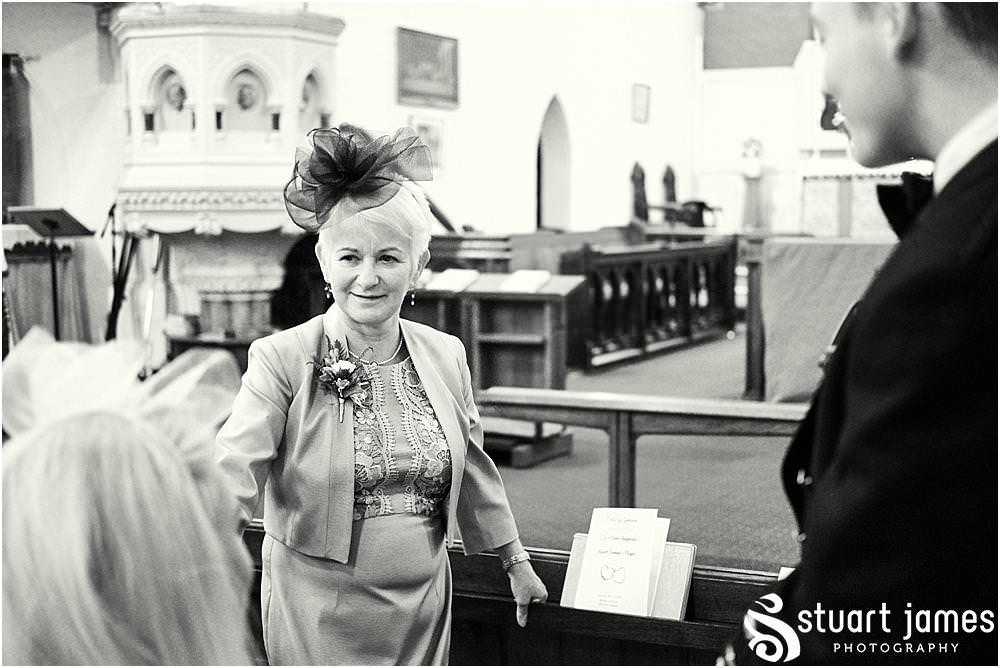 Candid photographs as the guests arrive for the wedding ceremony at All Saints Church in Bloxwich by Documentary Wedding Photographer Stuart James