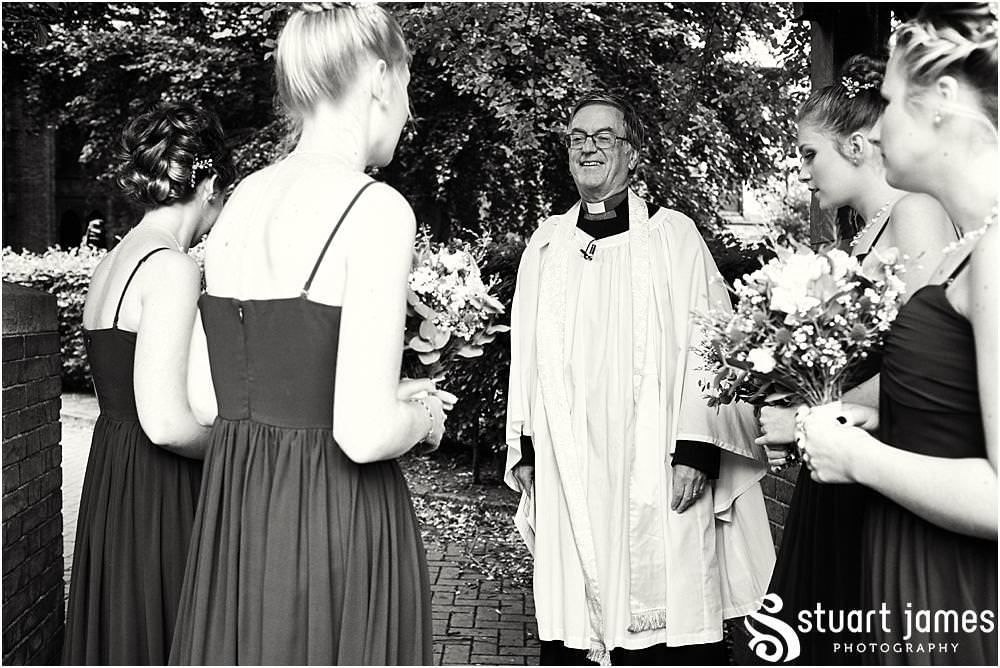 Documenting the arrival of the bridal party at All Saints Church in Bloxwich by Documentary Wedding Photographer Stuart James