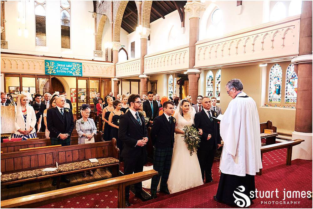 Capturing the beautiful moment as our bride arrives to her waiting groom at All Saints Church in Bloxwich by Documentary Wedding Photographer Stuart James