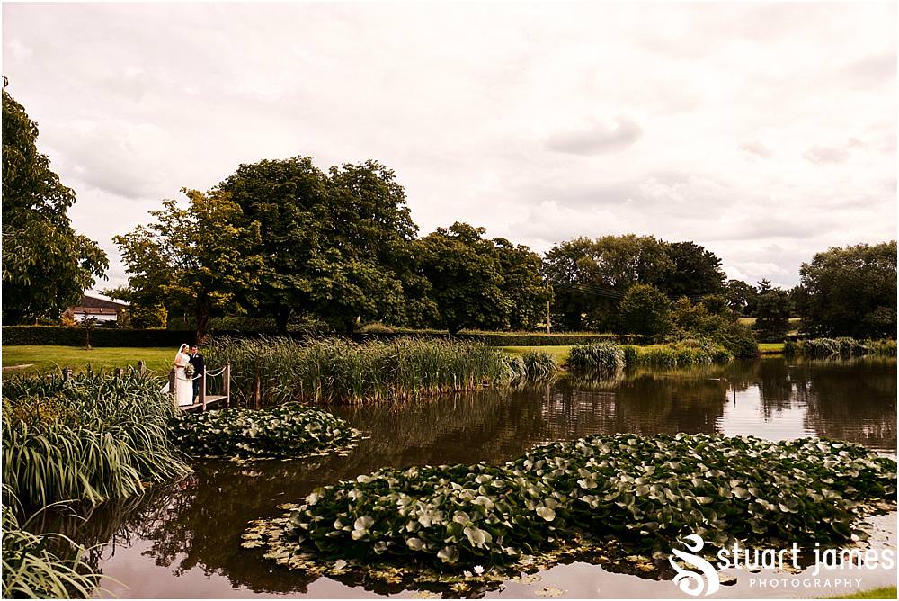 Relaxed and creative portraits of the bride and groom in the stunning grounds at The Moat House in Acton Trussell by Documentary Wedding Photographer Stuart James