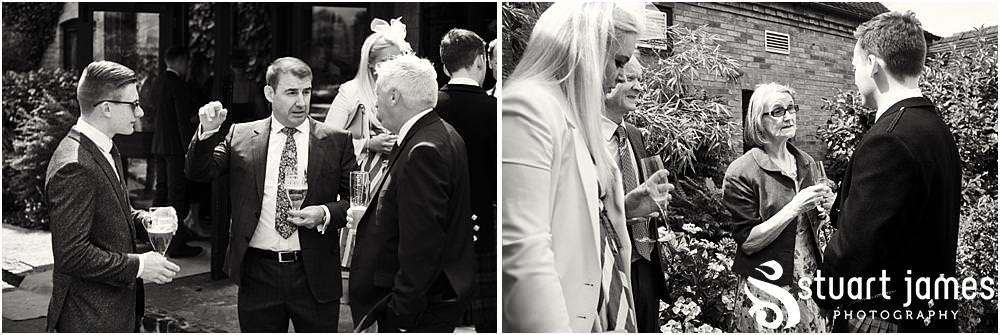 Candid photos of the guests relaxing in the wonderful setting at The Moat House in Acton Trussell by Documentary Wedding Photographer Stuart James