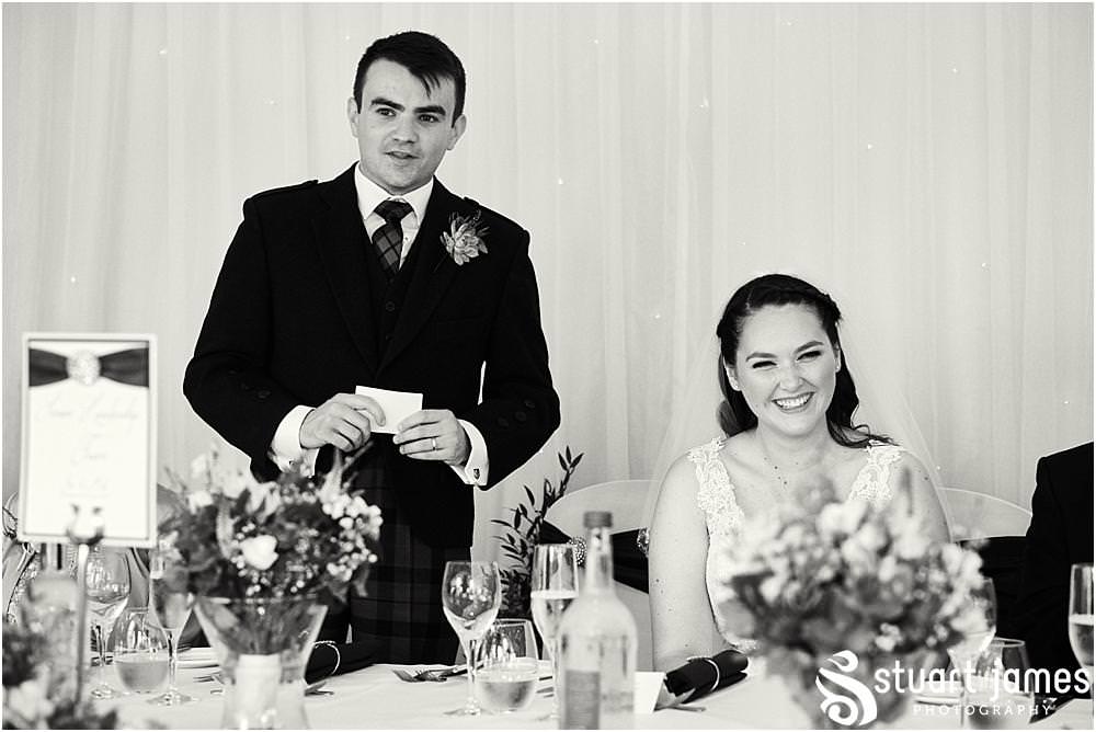 Photos that show the emotion and the wonderful reactions to the grooms speech at The Moat House in Acton Trussell by Documentary Wedding Photographer Stuart James