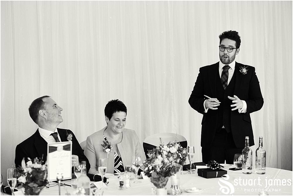 Perfectly toned and delivered speech by the Best Man with wonderful reactions from all of the guests at The Moat House in Acton Trussell by Documentary Wedding Photographer Stuart James