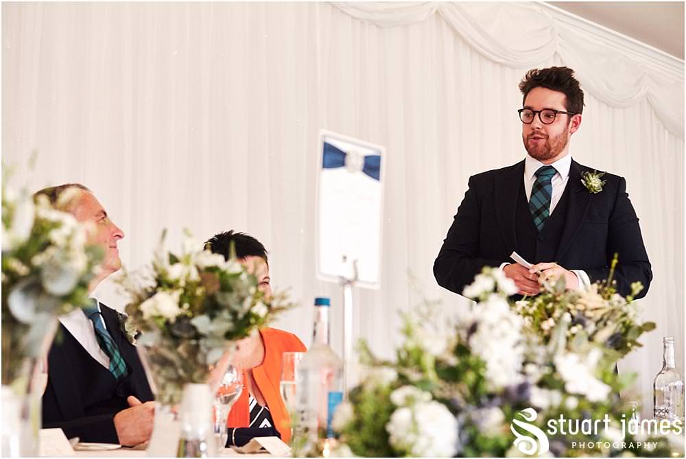 Perfectly toned and delivered speech by the Best Man with wonderful reactions from all of the guests at The Moat House in Acton Trussell by Documentary Wedding Photographer Stuart James