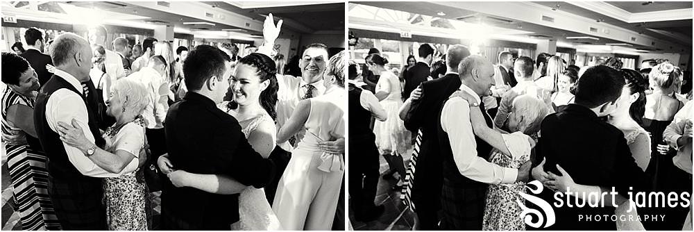 Capturing the fun of the evening reception as the dance floor fills for a fabulous night at The Moat House in Acton Trussell by Documentary Wedding Photographer Stuart James
