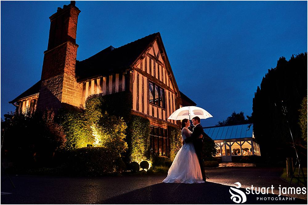 Creative rain portraits with the Bride and Groom at The Moat House in Acton Trussell by Documentary Wedding Photographer Stuart James