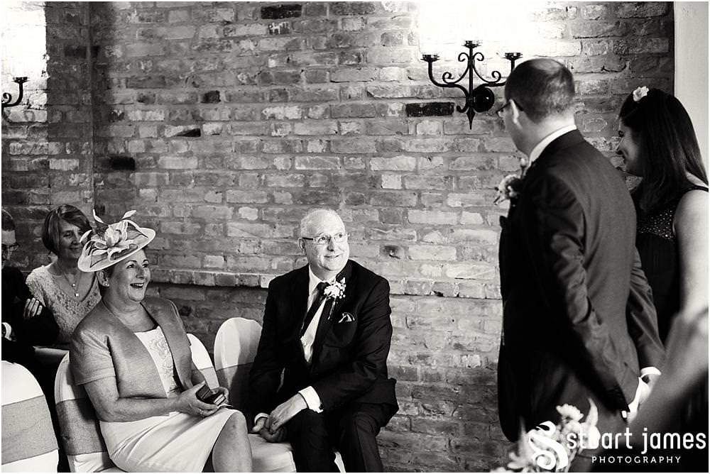 Documenting the entrance of the bridal party to the ceremony at The Crows Nest at Barton Marina by Documentary Wedding Photographer Stuart James
