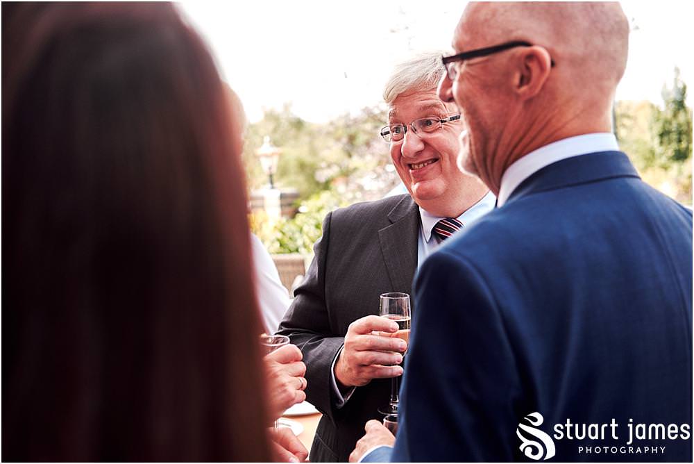 Creative candid photographs as the guests enjoy the drinks reception at The Crows Nest at Barton Marina by Documentary Wedding Photographer Stuart James