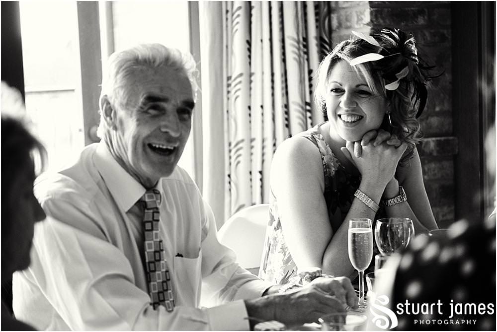 Creative candid photographs as the guests greet the bride and groom in to the wedding breakfast at The Crows Nest at Barton Marina by Documentary Wedding Photographer Stuart James