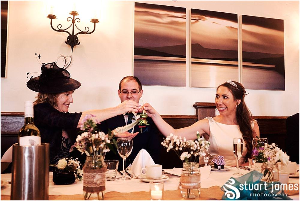 Wedding photos that show the mood and reaction to the beautiful speeches from the Father of the Bride at The Crows Nest at Barton Marina by Documentary Wedding Photographer Stuart James