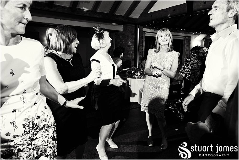 Creative fun photographs showing the fabulous evening reception at The Crows Nest at Barton Marina by Documentary Wedding Photographer Stuart James