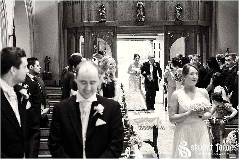 Capturing the stunning entrance of our bridal party into the wedding at Holy Trinity Church in Sutton Coldfield by Documentary Wedding Photographer Stuart James