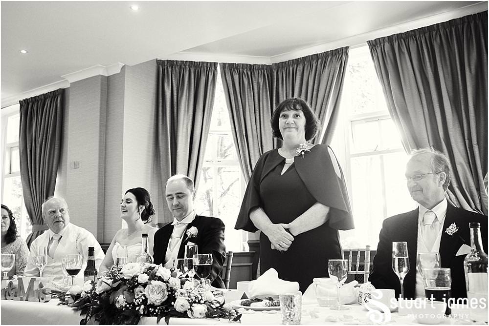 Great scenes as the Best Mans speech goes down a storm at The Belfry in Sutton Coldfield by Documentary Wedding Photographer Stuart James