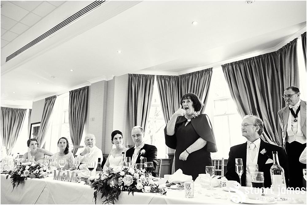 Great scenes as the Best Mans speech goes down a storm at The Belfry in Sutton Coldfield by Documentary Wedding Photographer Stuart James