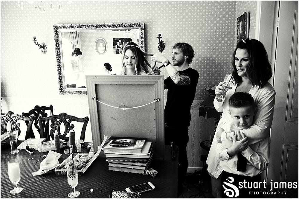 Reportage photos that capture the magic of the wedding morning preparations at home before the wedding at Bishton Hall in Stafford by Documentary Wedding Photographer Stuart James